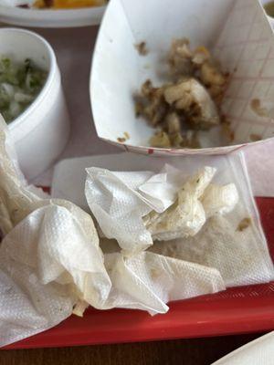 Greasy napkins and fat pulled from just two small street tacos! Husband said it tasted like boiled meat