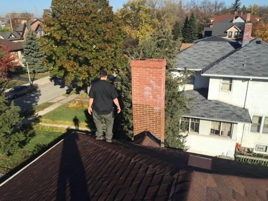 Evan enjoying a nice day on top of this old house.