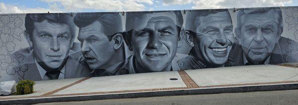 Mural of Andy thru his career.   Artist spray painted this in 2 weeks.