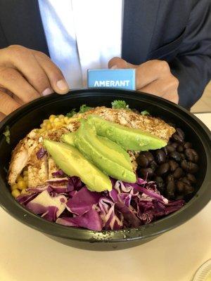 Chicken Cilantro lime grain bowl: Sliced avocado ,chicken, black beans, white rice, red cabbage, corn and cilantro sauce on the side