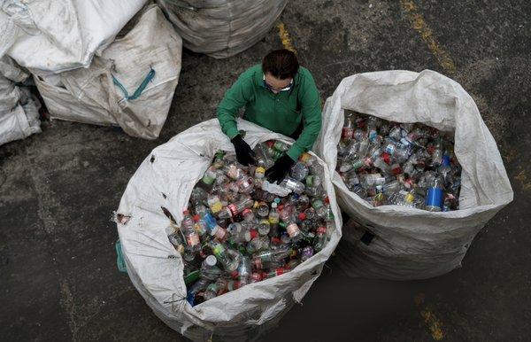 Staff member sorting plastic #1