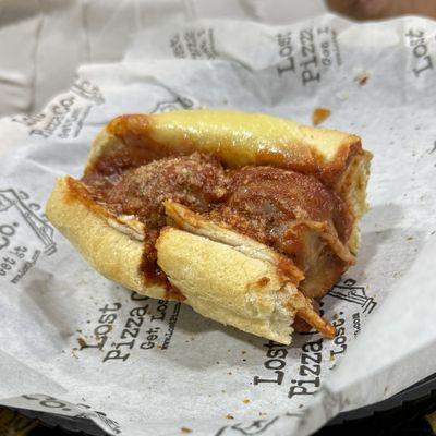 Half-eaten Meatball Sub