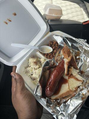 Potato Salad, baked beans and polish Sausage Sandwich