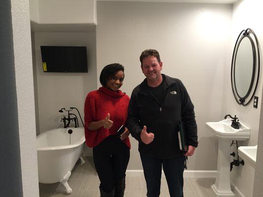 A very happy customer with her newly remodeled master bathroom by Allison Plumbing!