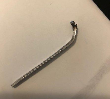 Some kind of nail/fastener with square sides and teeth..