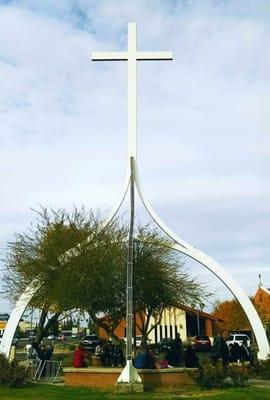 The large white cross near the parish office. It was used when Saint Pope John Paul II visited in September 1987 AD.