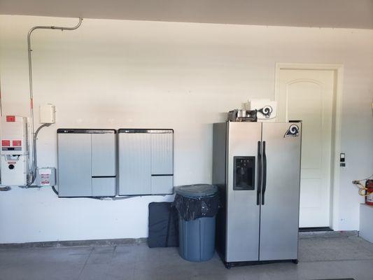 Corona install with inverter and battery storage installed inside garage.