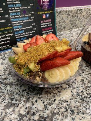 Açaí bowl with Kiwi, banana, strawberries, pineapple, extra granola, whey protein, agave nectar, and Nutella.