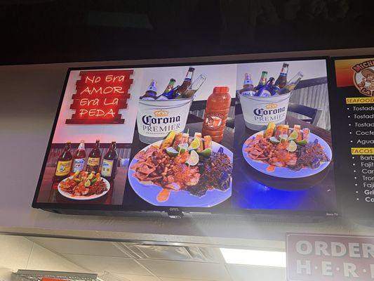 The botana platter includes classic Mexican beer snacks: cucumbers, shrimp, jerky, and peanuts with Tajin, limes, and chili sauce.