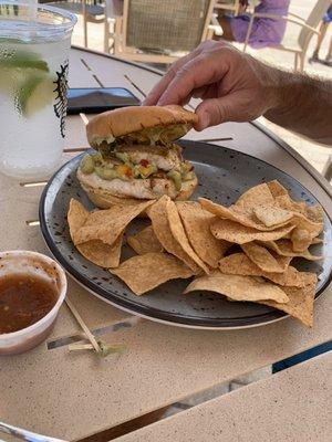 Blackened Mahi sandwich with mango salsa and avocado drizzle, chips and salsa. Very good.