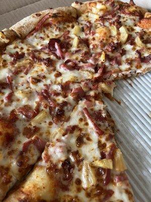 Large hand-tossed pizza with pineapple, ham, and bacon