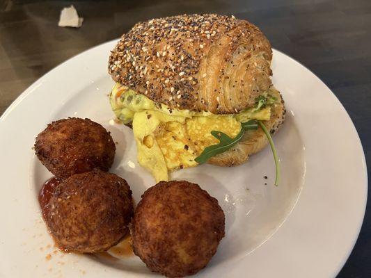 Everything Croissant Breakfast Sandwich with Cheesy Hashbrown bites.