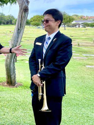 Funeral Director Wyatt Nagao.  Skillfully plays trumpet and is very attentive.