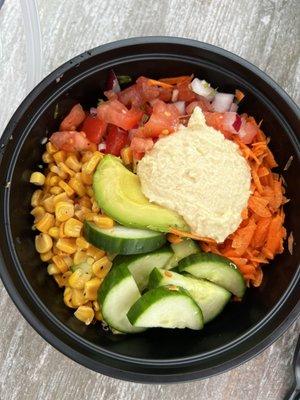 Buddha bowl (Quinoa, cucumber, pico, roasted corn, shredded carrot, avocado, and garlic hummus - $10)