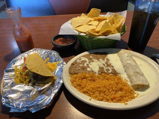 Combo with beef taco, chicken enchilada with cheese sauce, rice and beans. Delish!