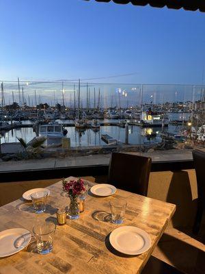 Covered patio seating looking out to harbor at Waterside in Channel Islands Harbor.