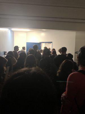 People trying to crowd into Norwegian flight at an outside hanger. It was the only flight that was delayed at lax.