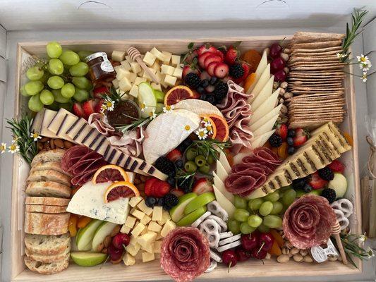 22" grazing board for a birthday party. This fed 10 adults and 5 kids for dinner with food left over!