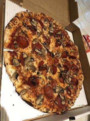 Large pepperoni and mushroom pizza with light cheese