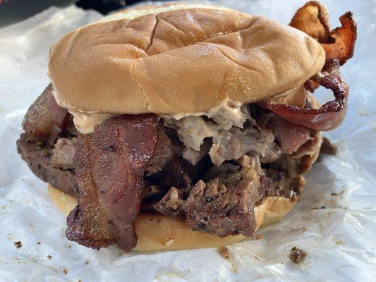 The Rancher Beef brisket, pulled pork, bacon, bbq sauce and chipotle mayo on a brioche bun.