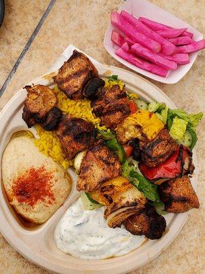 Chicken Kebab Plate - Served with hummus, tzatziki, Mediterranean salad, turmeric rice & housemade fresh pita bread.