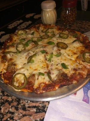 Sausage pizza with green peppers, onions, and jalapeños!