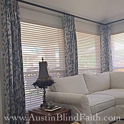 Motorized window shadings paired with drapery panels add style and function.