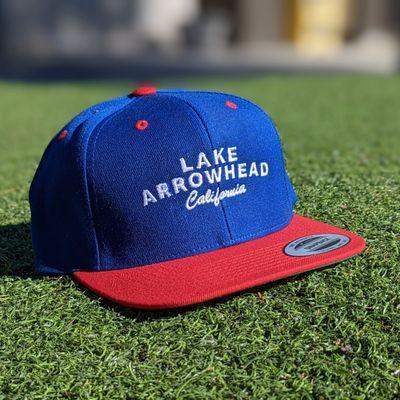 Our traditional Lake Arrowhead Classic Snapback Baseball Hat in Red and Blue by Sport-Tek®