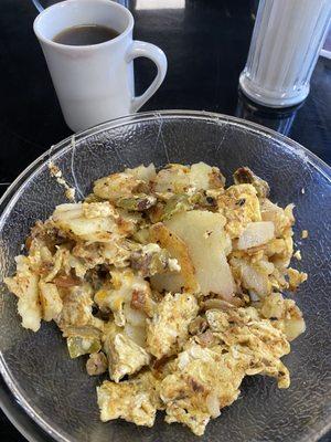 Breakfast scramble with sausage, grilled onions and green peppers, sausage and potatoes.