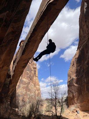 Rappelling down behind the arch!