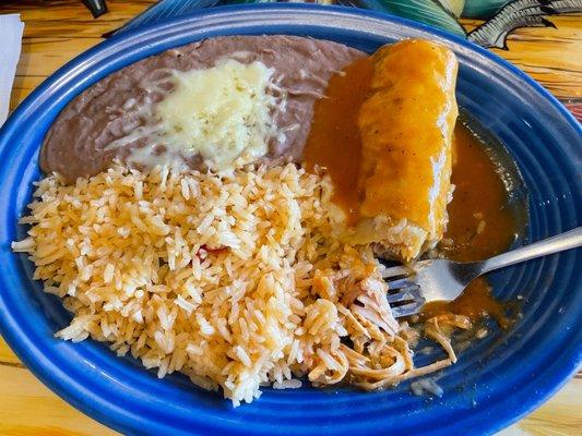 Lunch chicken enchilada with rice and refried beans. Yumm.