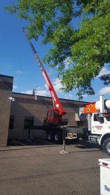 Installing new roof top unit on roof in Buffalo Grove