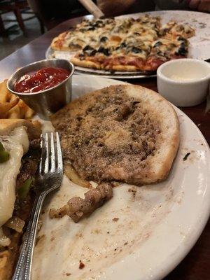 Philly cheesesteak sandwich, done with the boneless ribeye. Delicious taste however does not go with their choice of bread.