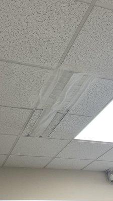 Vent that has been broken for 9 months patched with medical tape by student