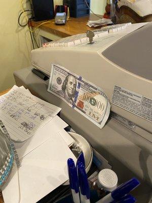 A 1 million dollar bill at the register.