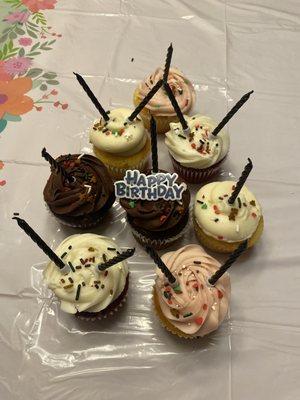 Lemon cupcakes, vanilla with strawberry frosting,  red velvet and chocolate with chocolate chips