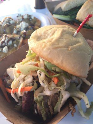 House smoked pulled pork slider, topped with apple carrot ginger slaw