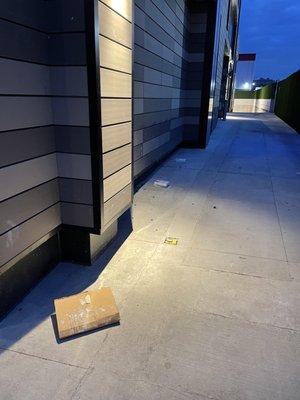 Trash around building exterior