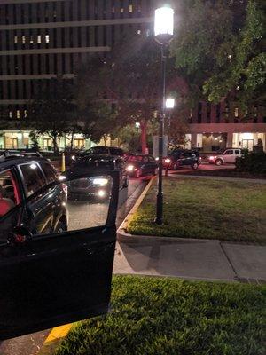 The line of cars waiting to get into the hospital