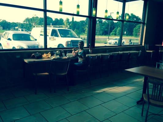 The indoor eating area, clean, complete with TVs and charging stations.