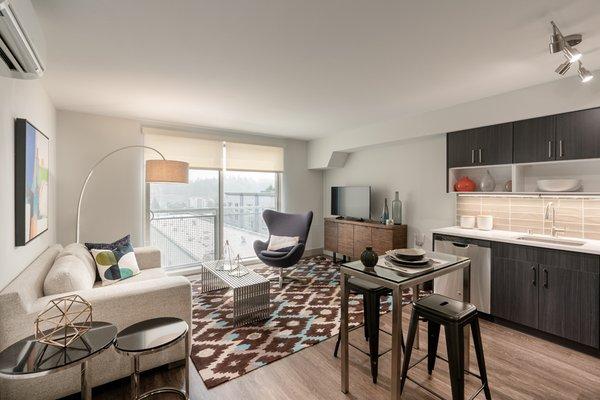 Floor-to-ceiling windows with solar shades in South Building apartments