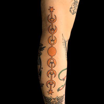 Harry Potter-themed tattoo down the back of a leg. This is from the Hogwart's Dueling Club. Very cool design