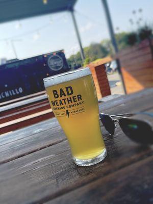 Outdoor patio with a food truck on site