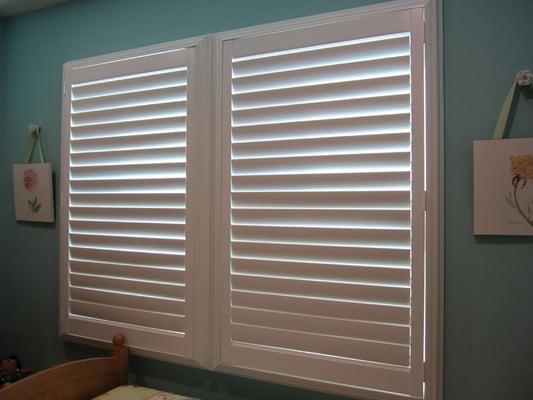 Decorative shutters can fit over noise control technical window assemblies for décor