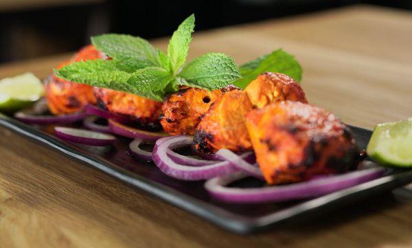 Look at this Juicy Chicken Tikka Kabab, Serve with Steam rice and Salad.