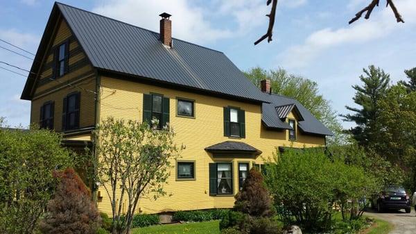 Side view of the home on a sunny morning.