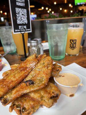 Fried green chile strips w housemade red chile ranch. Mother-in-law of Dragons hazy IPA in the background.