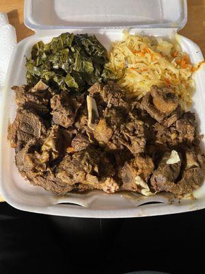 Large curry goat with cabbage,   greens, and rice and peas..