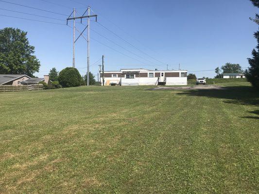 On market!! 1+ acres with utilities and 2BR mobile home.