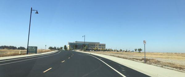 As you drive in, the building amongst the open land